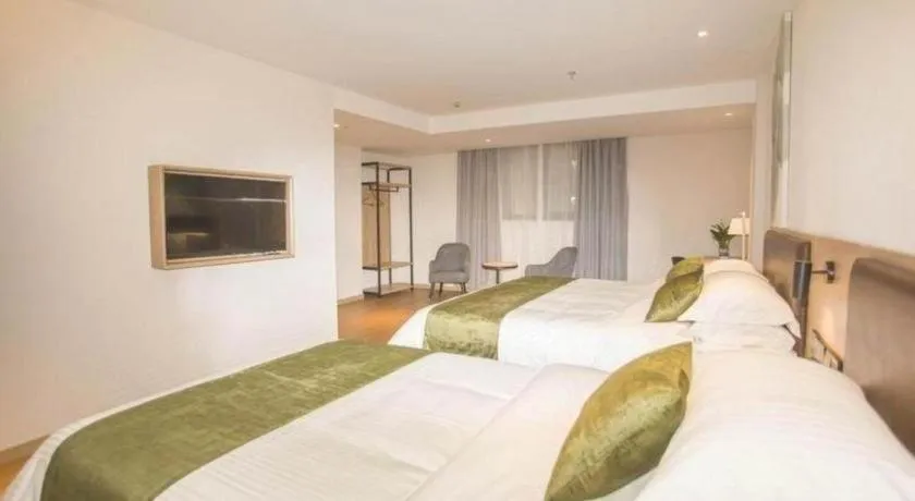 Bed in GreenTree Inn Express Taizhou Jiangyan Hardware City