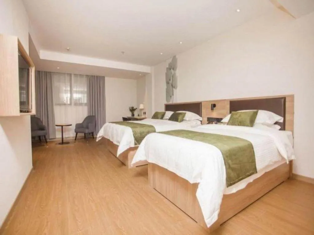 Bed in GreenTree Inn Express Taizhou Jiangyan Hardware City