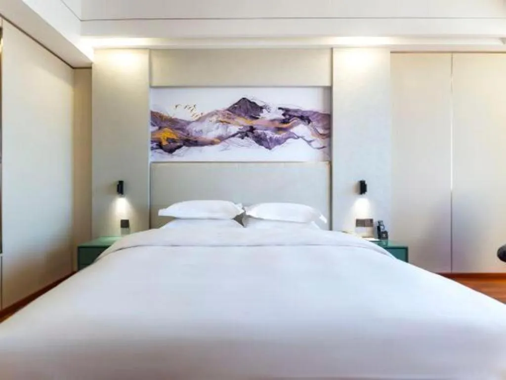 Bed in Junyu Grand Hotel Qinhuangdao