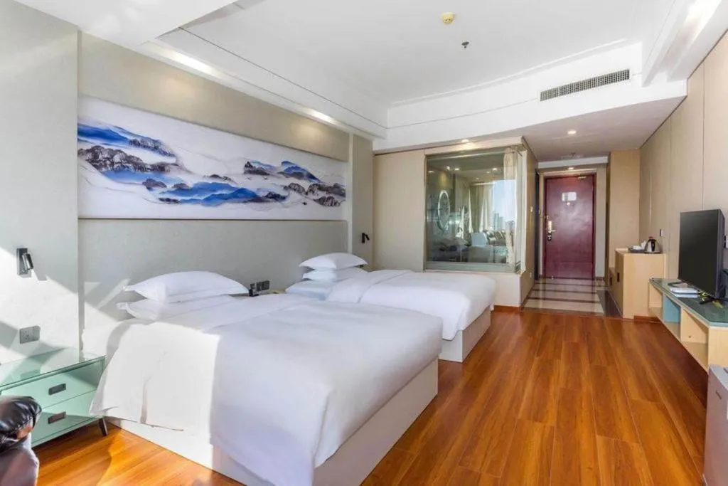 Bed in Junyu Grand Hotel Qinhuangdao