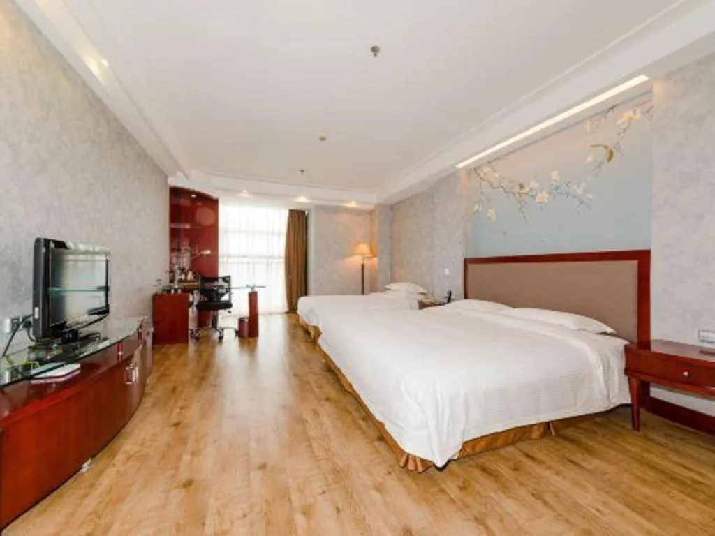 Bed in Junyu Grand Hotel Qinhuangdao