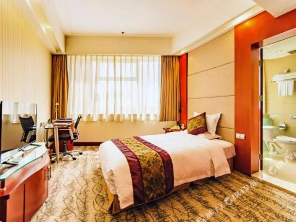 Bed in Junyu Grand Hotel Qinhuangdao