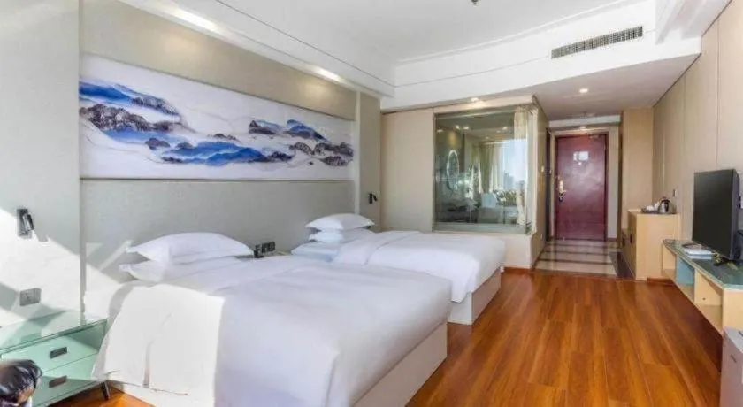 Bed in Junyu Grand Hotel Qinhuangdao