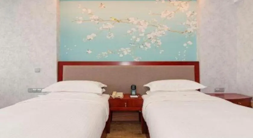 Bed in Junyu Grand Hotel Qinhuangdao