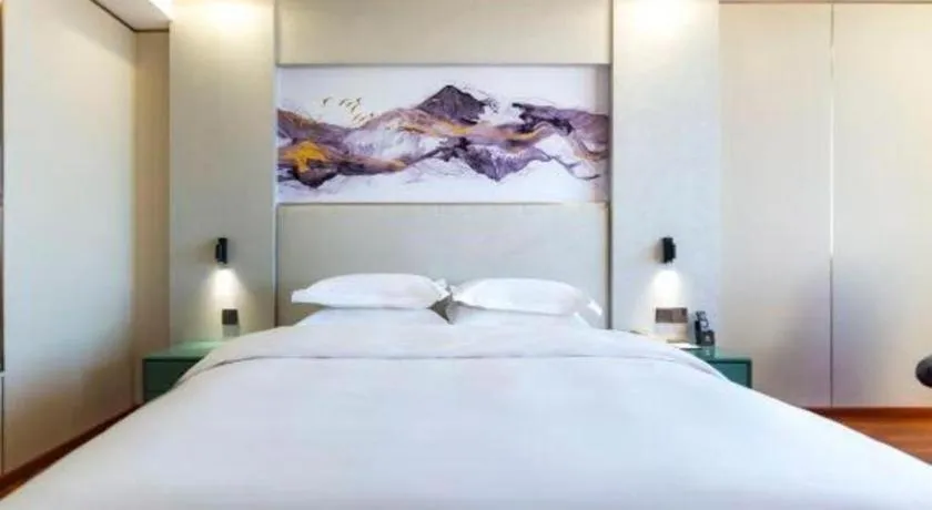 Bed in Junyu Grand Hotel Qinhuangdao