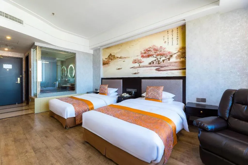 Bed in Junyu Grand Hotel Qinhuangdao