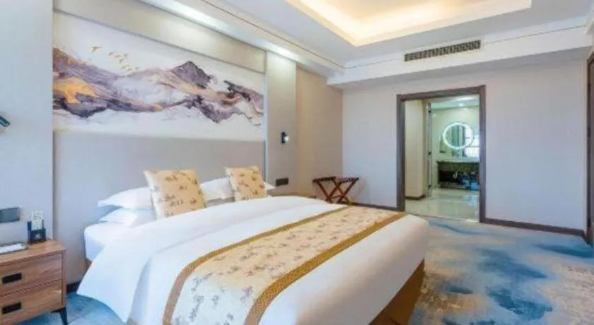 Bed in Junyu Grand Hotel Qinhuangdao