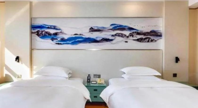 Bed in Junyu Grand Hotel Qinhuangdao