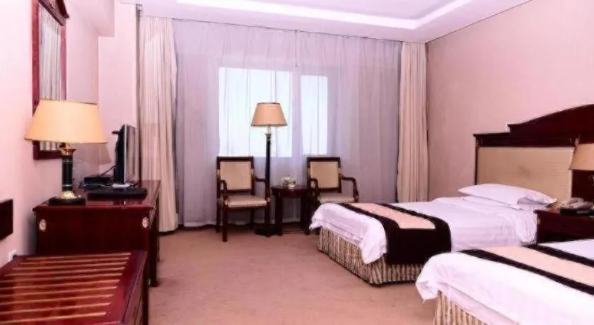 Bed in Heilongjiang Kunlun Hotel