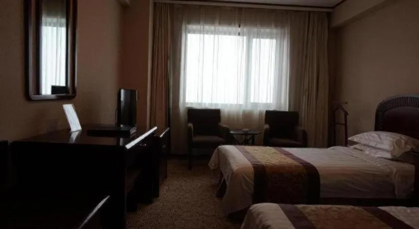 Bed in Heilongjiang Kunlun Hotel
