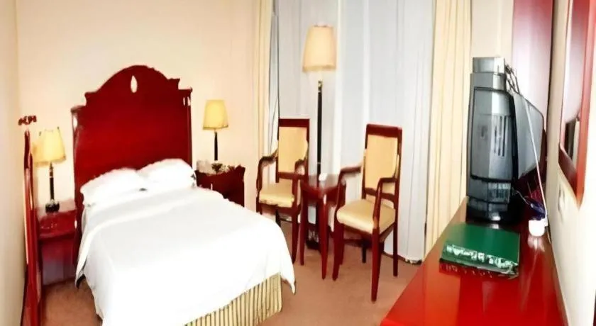 Bed in Heilongjiang Kunlun Hotel