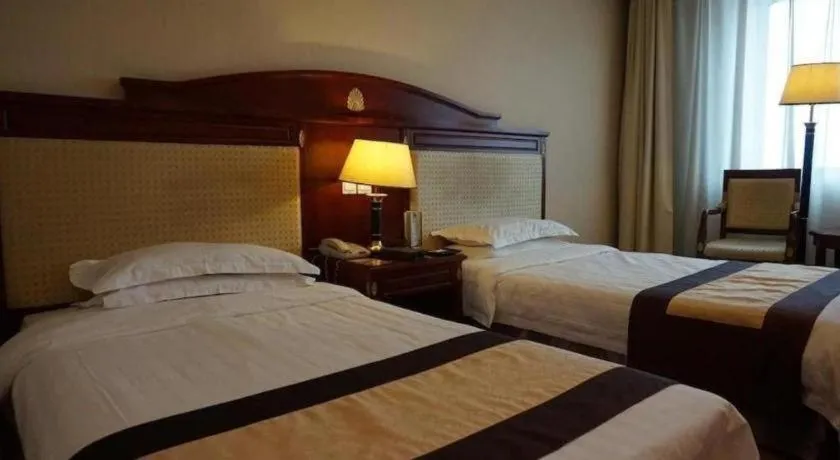 Bed in Heilongjiang Kunlun Hotel