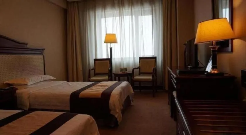 Bed in Heilongjiang Kunlun Hotel