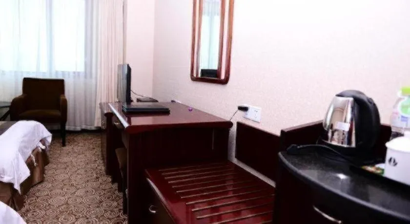 Bed in Heilongjiang Kunlun Hotel