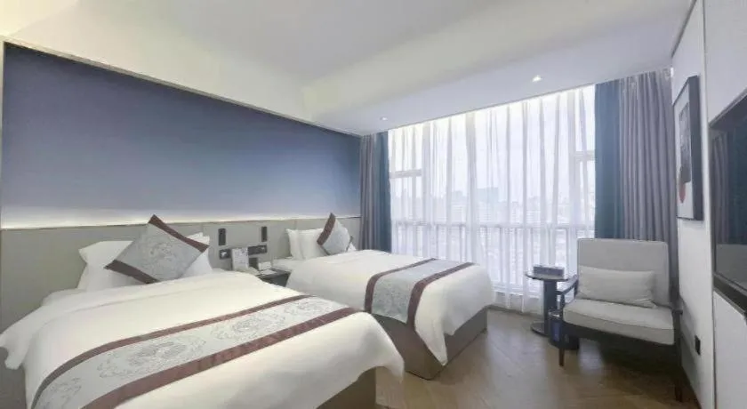 Bed in Xinyuan Hot Spring Hotel