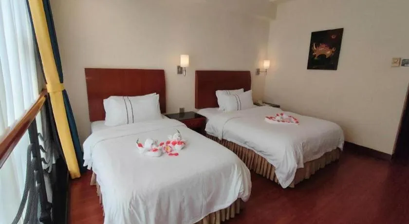 Bed in Xinyuan Hot Spring Hotel