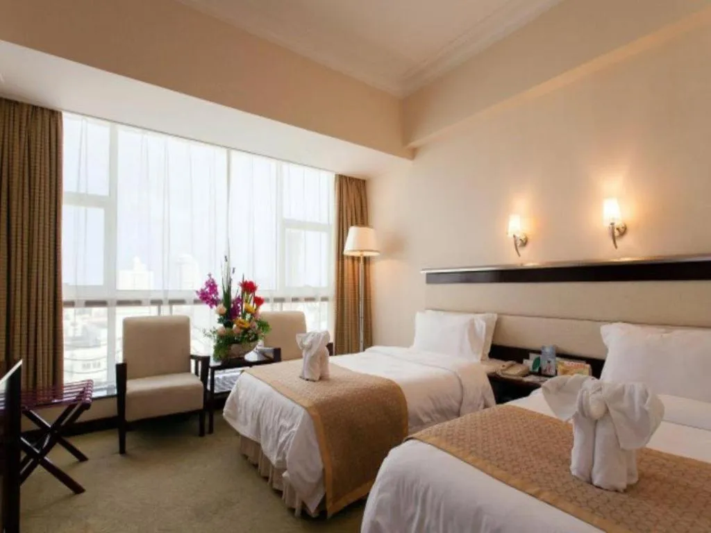 Bed in Xinyuan Hot Spring Hotel