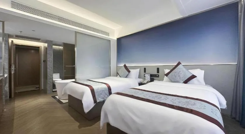 Bed in Xinyuan Hot Spring Hotel