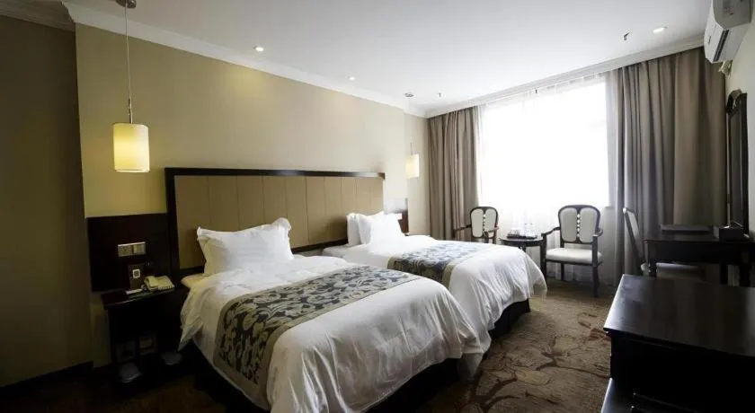 Bed in Sun Island Holiday Hotel