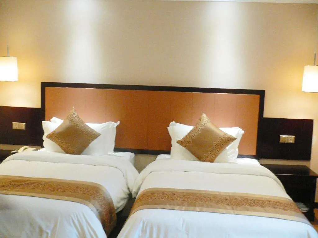 Bed in Sun Island Holiday Hotel