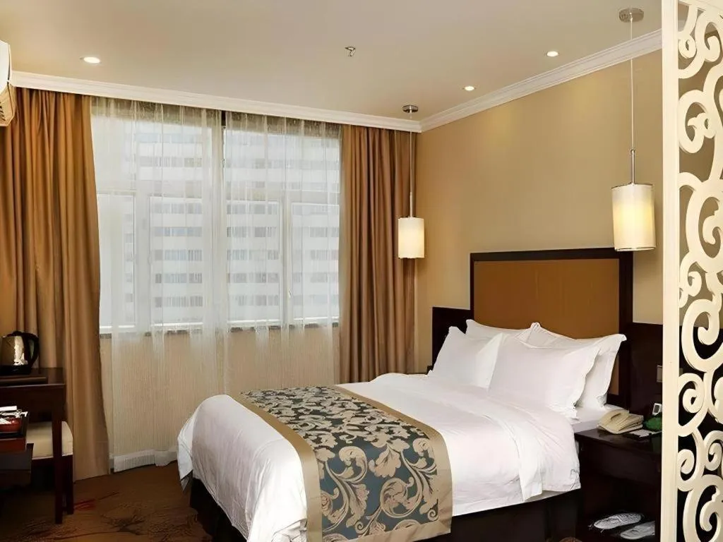 Bed in Sun Island Holiday Hotel