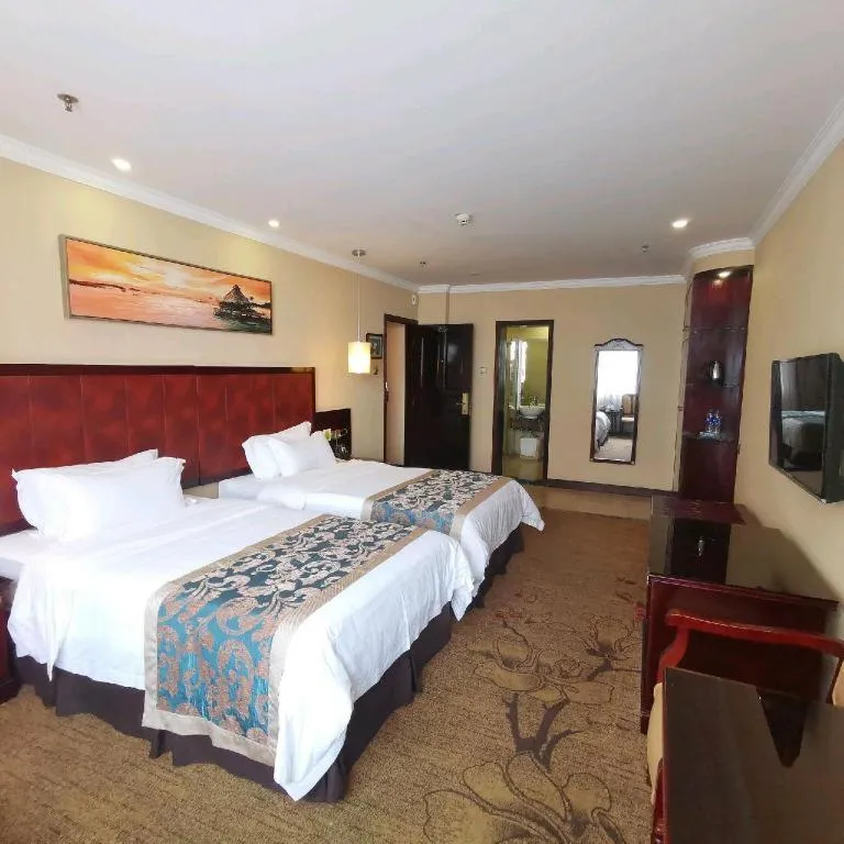 Bed in Sun Island Holiday Hotel