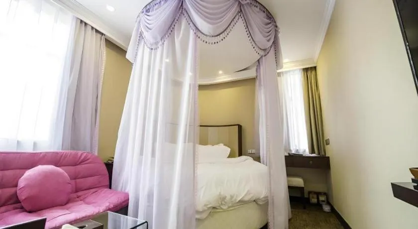 Bed in Sun Island Holiday Hotel