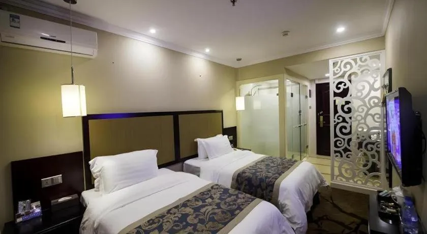 Bed in Sun Island Holiday Hotel