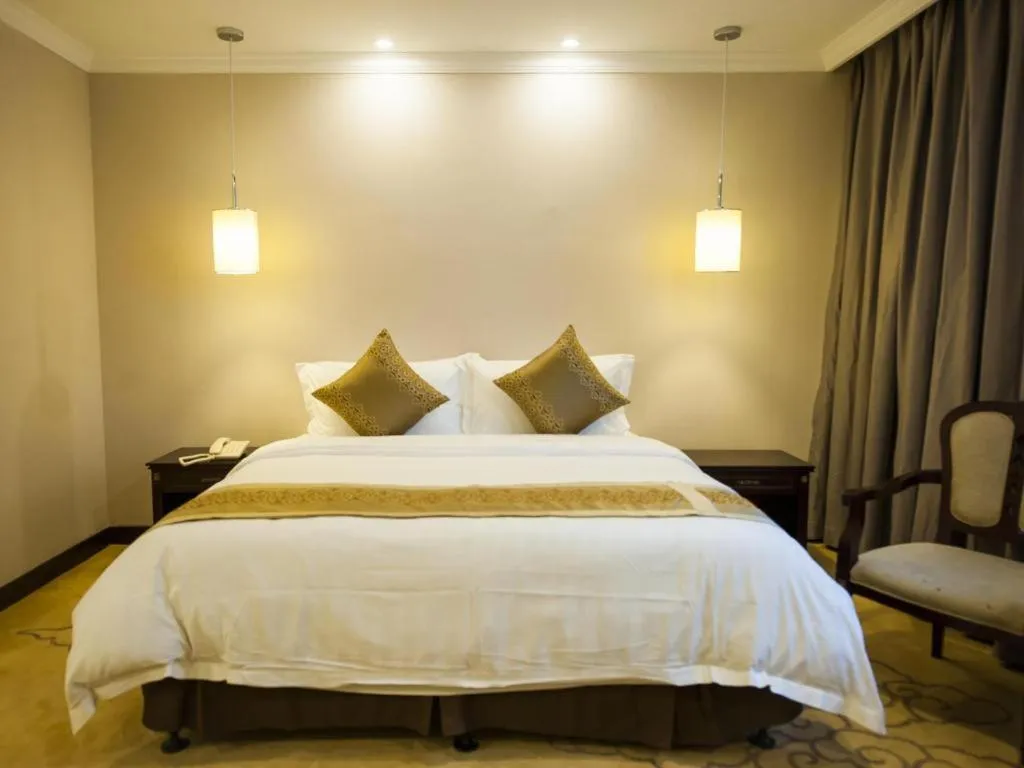 Bed in Sun Island Holiday Hotel