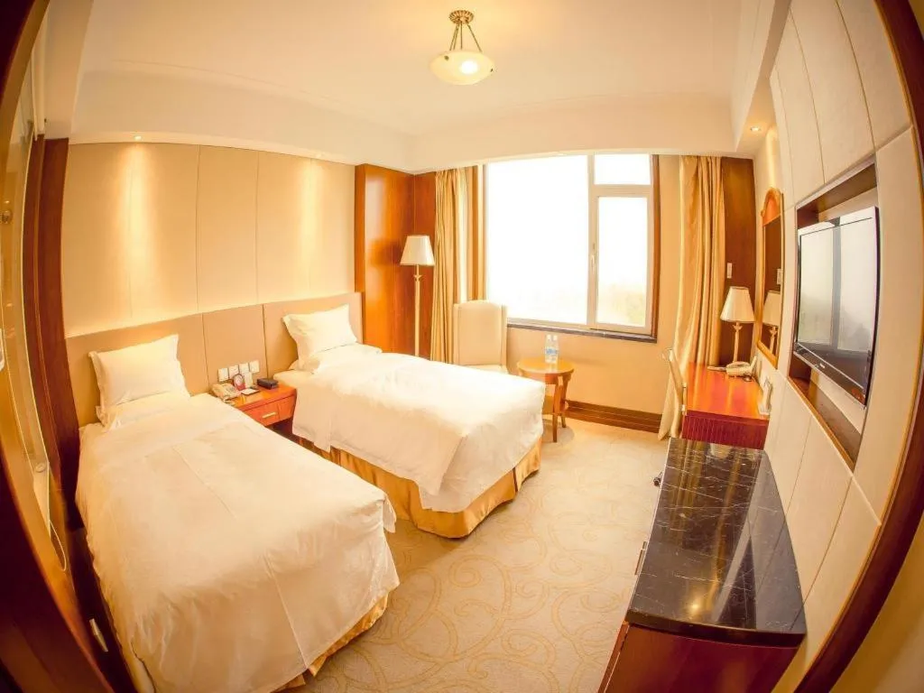 Bed in Golden Bay Hotel Weihai