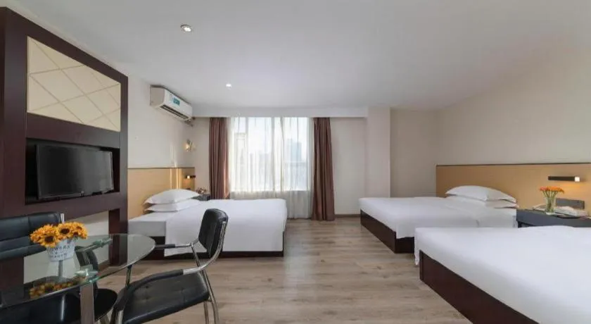 Bed in GreenTree Inn Zhongshan Nanlang Metro Station Branch