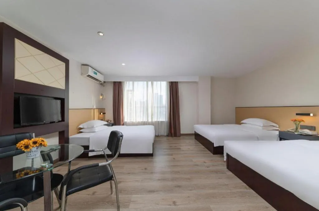 Bed in GreenTree Inn Zhongshan Nanlang Metro Station Branch