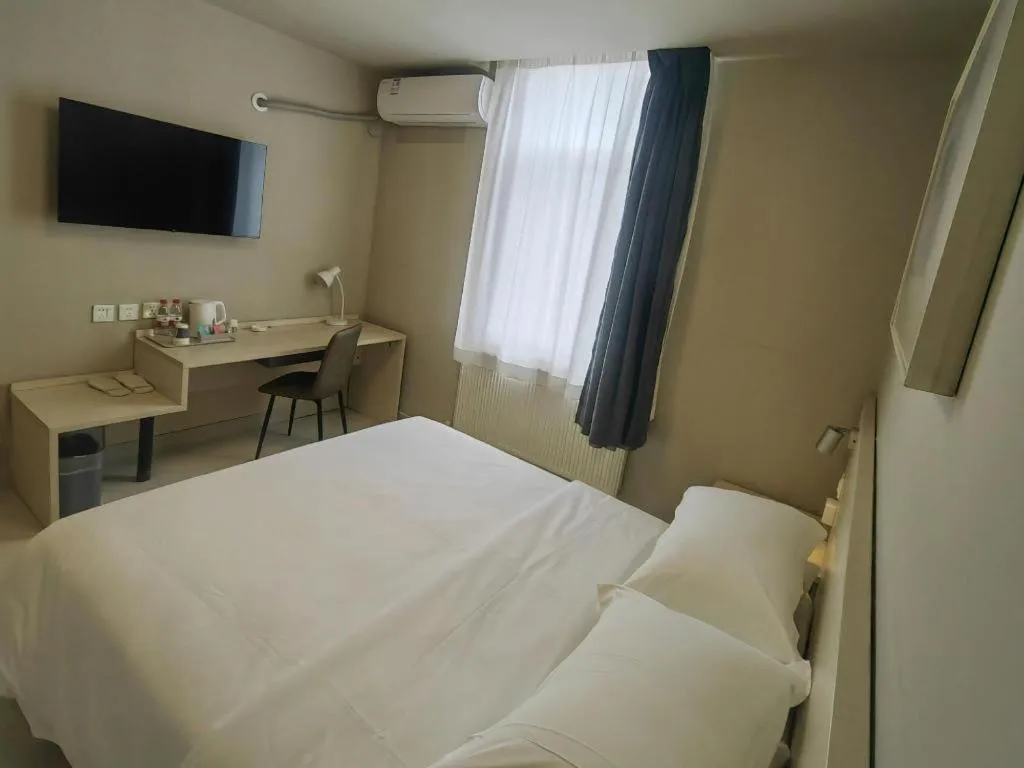 Bed in Jinjiang Inn Qingdao International Exhibition Center Haier Road