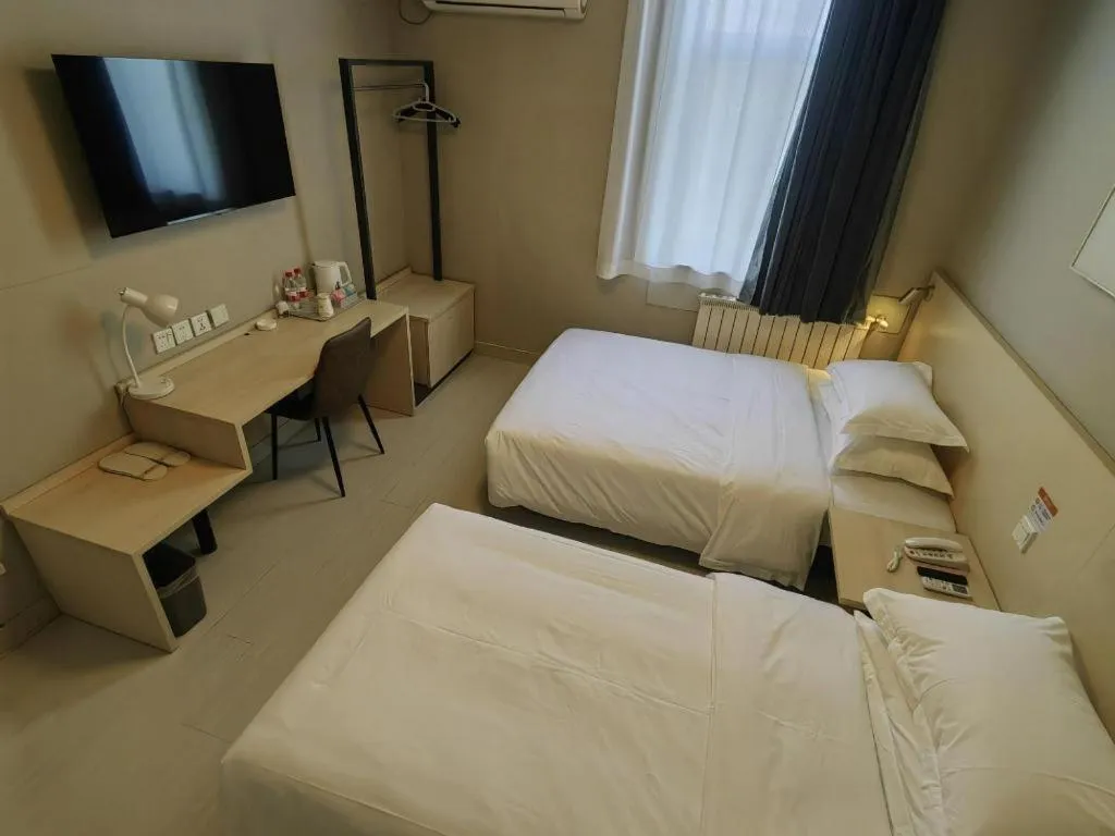 Bed in Jinjiang Inn Qingdao International Exhibition Center Haier Road