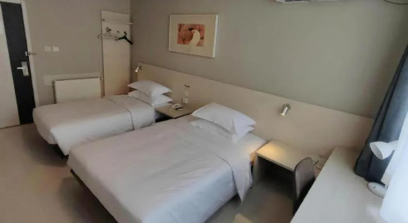 Bed in Jinjiang Inn Qingdao International Exhibition Center Haier Road