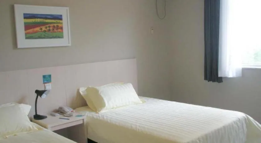 Bed in Jinjiang Inn Qingdao International Exhibition Center Haier Road