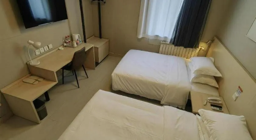 Bed in Jinjiang Inn Qingdao International Exhibition Center Haier Road