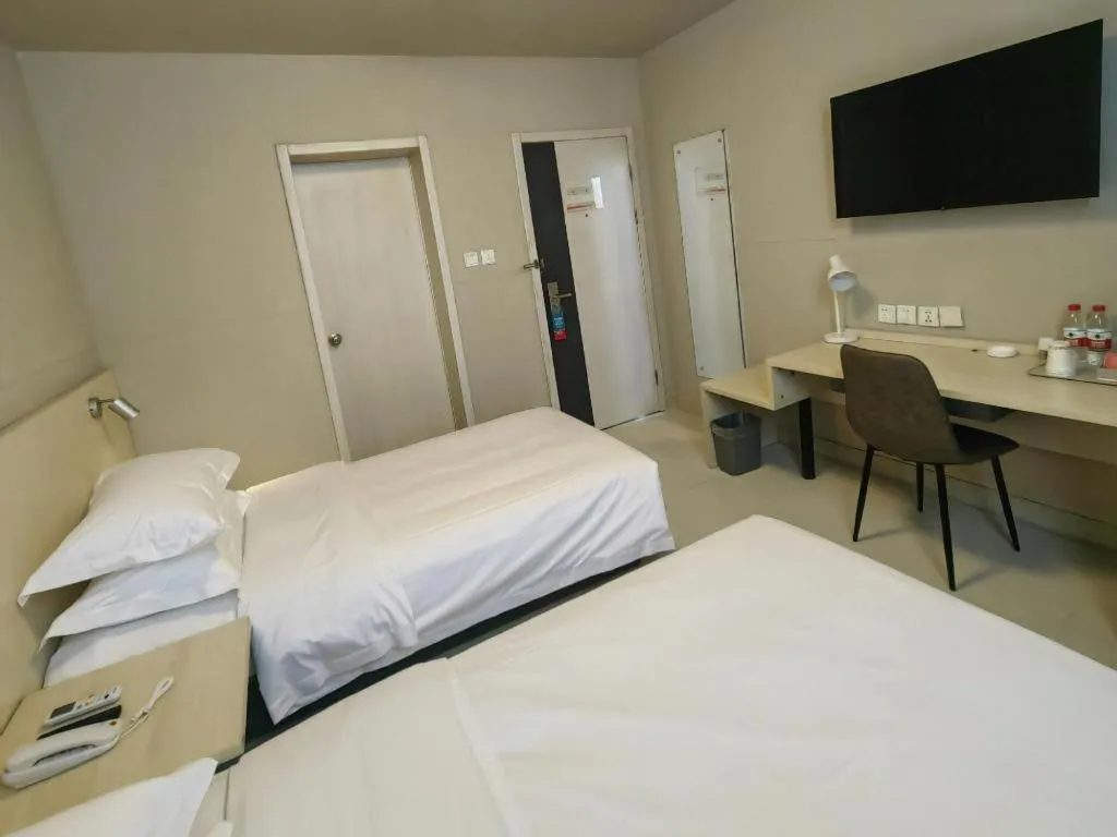 Bed in Jinjiang Inn Qingdao International Exhibition Center Haier Road