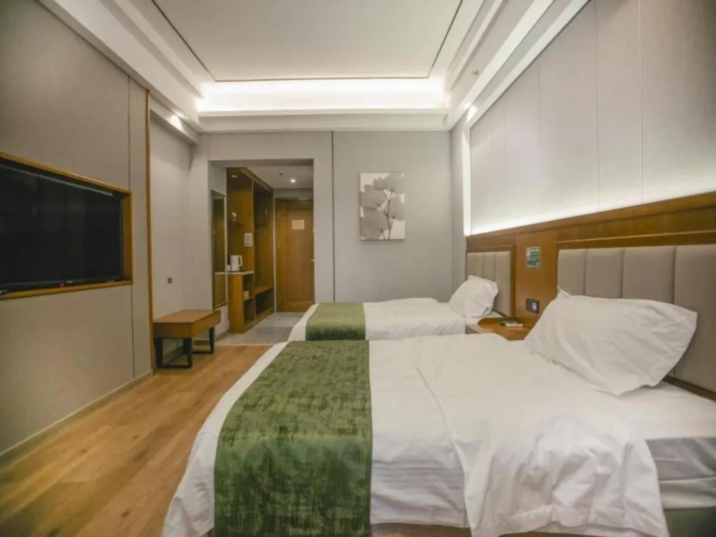 Bed in GreenTree Inn Jiuquan Century Plaza Hotel