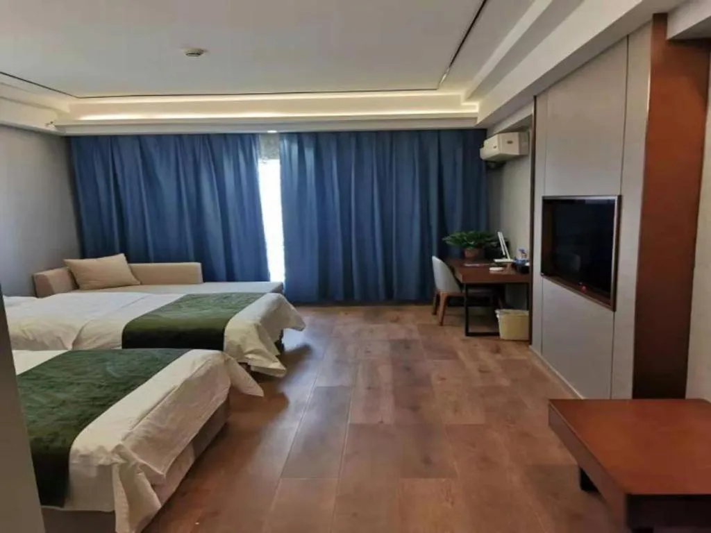 Bed in GreenTree Inn Jiuquan Century Plaza Hotel