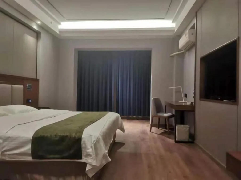 Bed in GreenTree Inn Jiuquan Century Plaza Hotel