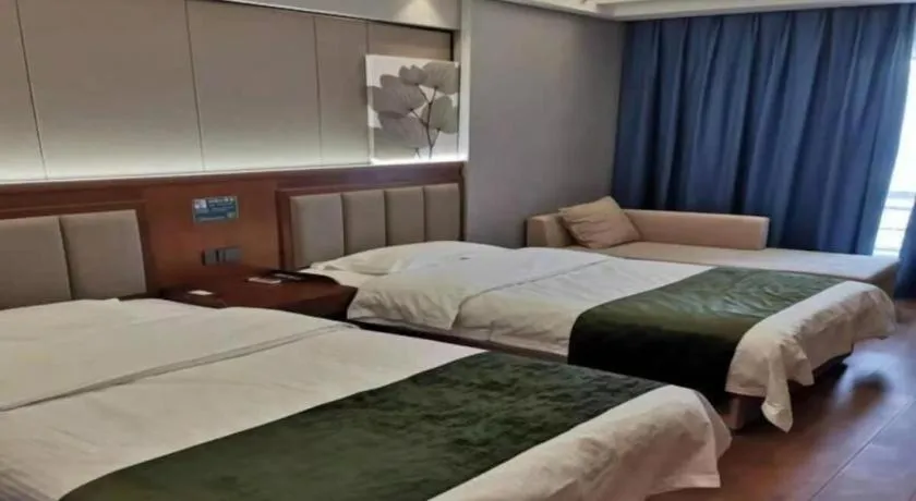 Bed in GreenTree Inn Jiuquan Century Plaza Hotel