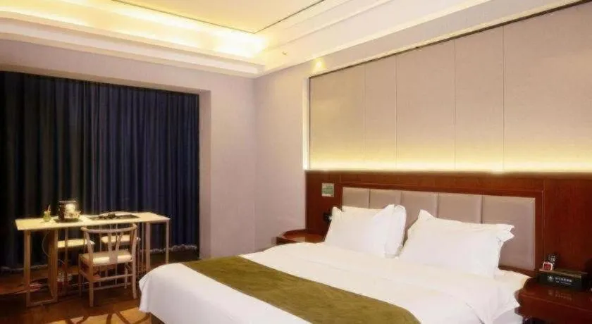 Bed in GreenTree Inn Jiuquan Century Plaza Hotel