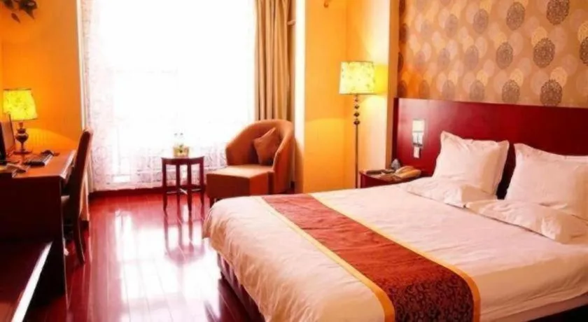 Bed in GreenTree Inn Jiuquan Century Plaza Hotel