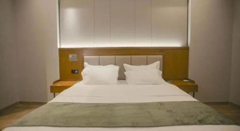 Bed in GreenTree Inn Jiuquan Century Plaza Hotel