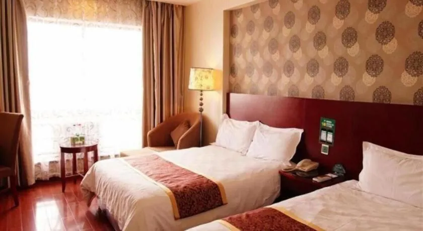 Bed in GreenTree Inn Jiuquan Century Plaza Hotel