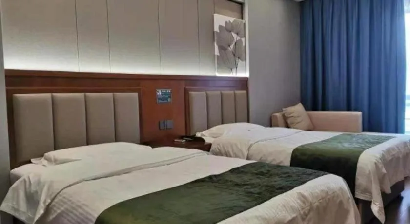 Bed in GreenTree Inn Jiuquan Century Plaza Hotel
