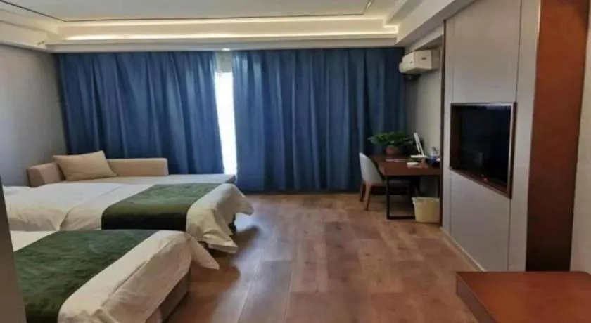 Bed in GreenTree Inn Jiuquan Century Plaza Hotel