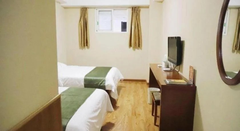 Bed in GreenTree Inn Yantai Xingfu Road Marina Plaza Express Hotel