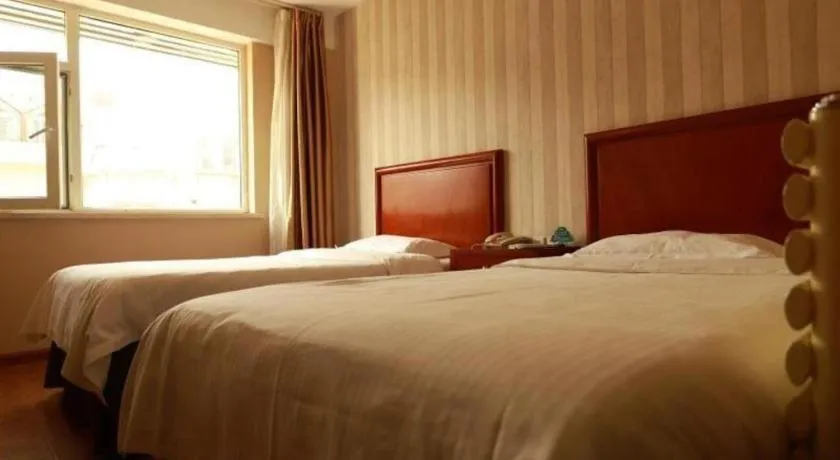 Bed in GreenTree Inn Yantai Xingfu Road Marina Plaza Express Hotel